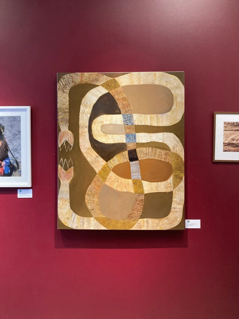 Image of the abstract artwork Open-ended Rite by jenny atina, displayed on a red wall at the vernissage of husby konstsalong 2026.